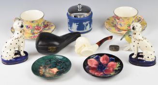 Two Moorcroft pin dishes, Royal Winton pair of chintz cups and saucers decorated in the Welbeck