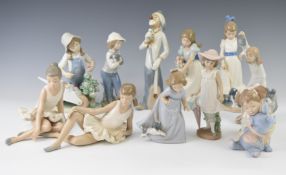 Twelve Nao figures including children and girl with flowers, tallest 25cm