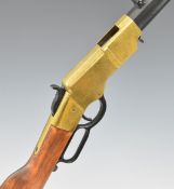Winchester style lever action replica rifle with wooden stock and brass coloured action, 109cm long.