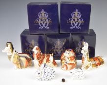 Five Royal Crown Derby paperweights in boxes, including American Spaniel, Llama and Welsh Corgi