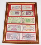 Ten British Armed Forces Special Vouchers including 5p, 10p, 50p and £1 examples, in glazed display,