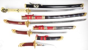 Four copy / replica Japanese Samurai swords, three with dragon head pommels, the other in the form