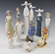 Nine Lladro and Nao figurines and an early Goebel Hummel figure, tallest 32cm