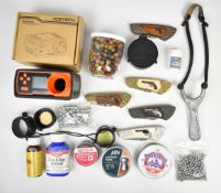 A collection of gun and shooting related items including knives, Acetech AC5000 chronograph, air