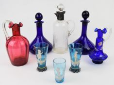 Eight pieces of clear and coloured glassware including a pair of Bristol Blue ship's decanters and
