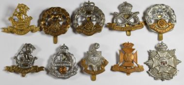 Ten British Army Infantry regiment badges including West Riding, Hampshire, Royal Sussex and South