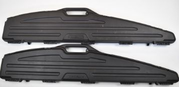Two rifle or shotgun hard carry or flight cases GunGuard and DoskoSport, both with padded interiors,