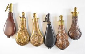 Six G&JW Hawksley, Sykes and similar powder and shot flasks, most with embossed decoration,