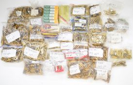 A large collection empty brass rifle cartridge cases including .303, 8x57, .17, .222, .460 WM, .