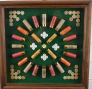 Shotgun cartridge advertising display board including Eley cartridges, in a glazed oak style painted