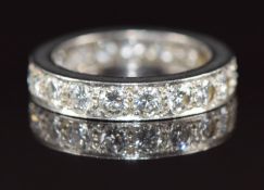 A platinum eternity ring set with 19 round cut diamonds, each approximately 0.12ct, 5.4g, size L