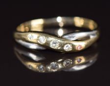 A 9ct bi-coloured gold ring set with diamonds in a twist setting, 1.4g, size R