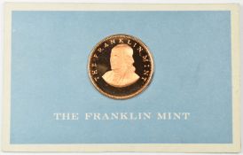 Franklin Mint 9ct gold coin in presentation pack, approximately 8g