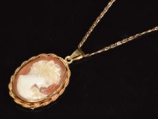 A 9ct gold pendant set with a cameo (3.7g, 2 x 3cm) on 9ct gold chain (2.4g, 39cm long)