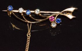 A 15ct gold brooch set with sapphires, diamonds and a ruby, 4.9g, 3.8cm