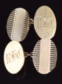 A pair of 9ct gold cufflinks with engine turned decoration and engraved initials, 7g