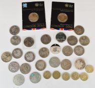 A collection of largely UK £5 coins, together with single metal £2 examples, including some