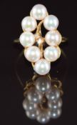 A 14k gold ring set with cultured pearls and diamonds, 4.5g, size M