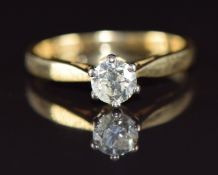 An 18ct gold ring set with a round brilliant cut diamond of approximately 0.5ct, 3.2g, size M
