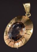 A 9ct gold pendant set with an oval cut smoky quartz, 5.7g, 2.9 x 2cm