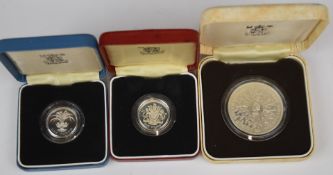 Royal Mint UK silver proof £1 coins for 1983 and 1985, both cased with certificates, together with a