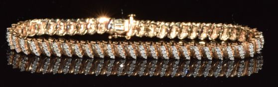 A 9ct gold diamond bracelet set with diamonds, 14.3g, 18.5cm long
