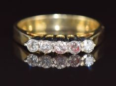 An 18k gold ring set with five diamonds, the total diamond weight approximately 0.4ct, 2.9g, size K