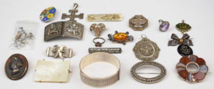 A collection of silver jewellery including Charles Horner bangle, eight brooches including