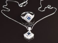 A 9ct white gold ring set with four sapphires surrounded diamonds (size K/L) with matching pendant