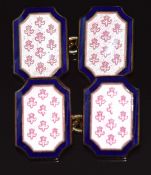 A pair of silver gilt cufflinks set with pink and blue enamel in a fleur de lys pattern, 15.1g