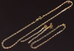 A suite of 18ct gold tri-coloured jewellery comprising necklace, bracelet and earrings, 15g