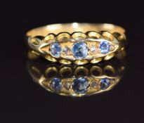 An 18ct gold ring set with sapphires and diamonds, Chester 1919, 1.8g, size J