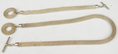 A matching silver necklace and bracelet