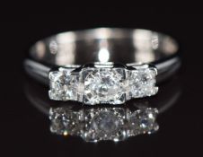 A 9ct white gold ring set with three diamonds totalling approximately 0.5ct, 2.4g, size N