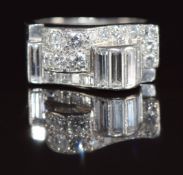 Art Deco platinum ring set with baguette and round cut diamonds, the total diamond weight