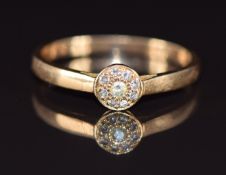 A 9ct gold ring set with diamonds in a cluster, 2.2g, size N