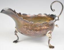 Georgian hallmarked silver sauce boat with shaped edge, raised on three feet, London 1761, maker's