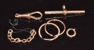 A 9ct rose gold clip and T bar, two sections of 9ct rose gold puzzle ring, and a section of 9ct curb