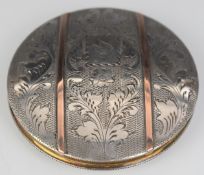 Continental silver compact with twin gold band decoration to lid, marked 835, diameter 8.5cm, weight