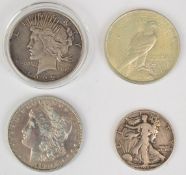 1883 USA Morgan dollar, together with a 1922 and 1923 Liberty peace dollar and 1942 half dollar