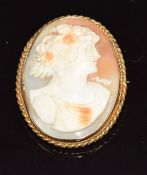 A 9ct gold brooch set with a cameo depicting a young woman, 7g, 3.2 x 2.6cm