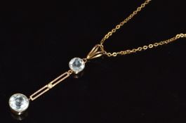 Edwardian 9ct gold pendant set with two aquamarines and a seed pearl (4.8cm) on 9ct gold chain, 3.