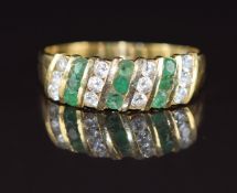 An 18k gold ring set with emeralds and cubic zirconia, 2.7g, size Q