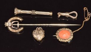 A 9ct rose gold clip, Victorian yellow metal stick pin in the form of a horseshoe and stirrup,
