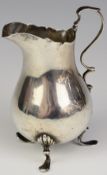 Victorian hallmarked silver jug raised on three feet, London 1890 or 1892, maker Charles Boyton (