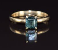 A 9ct gold ring set with an emerald cut green sapphire, 4.2g, size T