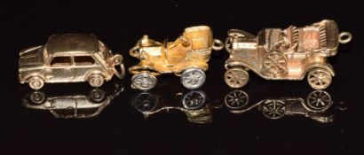 Three 9ct gold charms in the form of cars, 15.3g