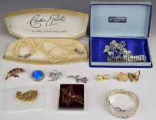 A collection of jewellery including silver bangle, diamanté bracelet and necklace, brooches, etc