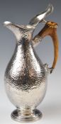 Silver plated horn handled ewer or jug with hammered finish, height 24cm