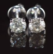A pair of 18k white gold earrings each set with a diamond of approximately, 0.78ct, 2.2g